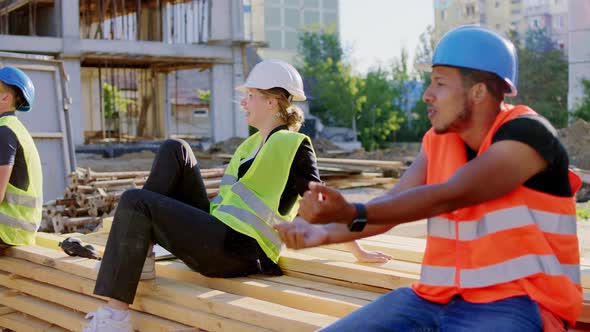 Group of Construction Workers and Foreman Middle