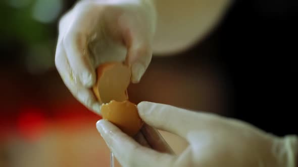 The Pastry Chef Separates The Egg White From The Yolk. Broken Egg Shell Two Halves. Cooking Ingredie