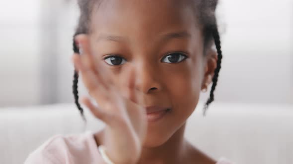 Portrait Face Child African American Little Girl Looking at Camera Waving Hello Greeting Webcam View