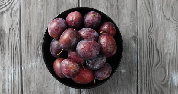 Bowl of Wet Ripe Plums