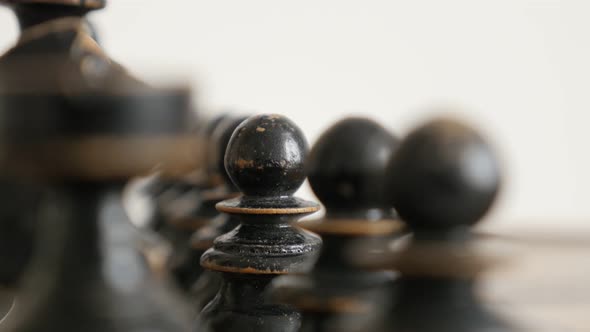 Black player wooden chessmans on  chequered game fields 4K 2160p 30fps UltraHD  footage - Close-up d alt