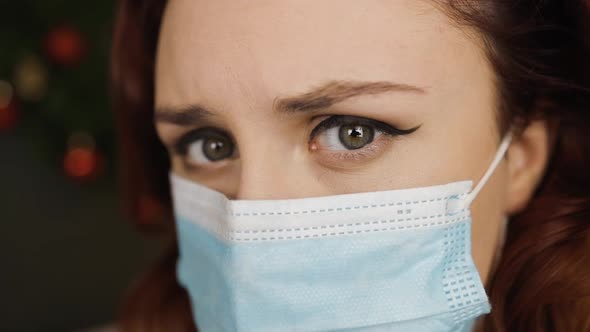 Macro Eye View Tired Young Woman in Medical Face Mask Looks at you