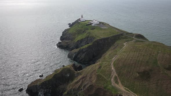 Baily Lighthouse, Dublin Bay And Howth Cliff Path In Ireland - aerial drone shot