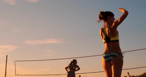 Young Girl Jump Serve Volleyball on the Beach, Slow Motion.