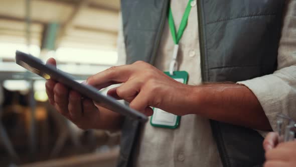 Farmer Hands Holding Tablet Computer Closeup