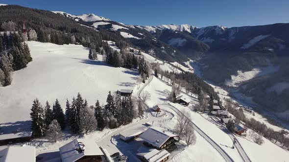 Aerial view of houses on a snowy mountain