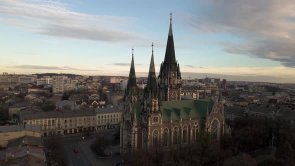 Golden sunlight cast on Church of Ohla and Elizabeth. Aerial.