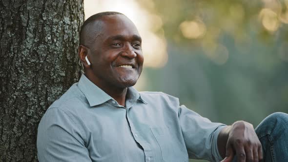 Portrait Elderly African Man Sitting Under Tree Entrepreneur Resting in Park