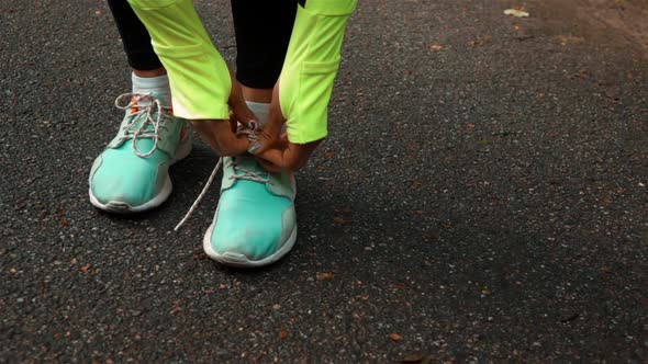 Woman Runner Tying the Shoelaces