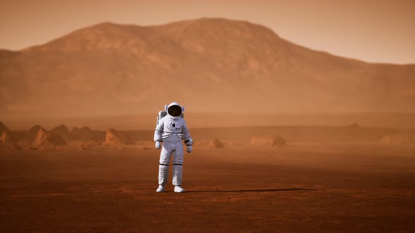 Astronaut on Mars Surface. Red Planet Covered in Gas and Rock alt