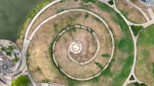 Butler Park Spiral in Austin Texas. Aerial orbit. Map of TX in center.