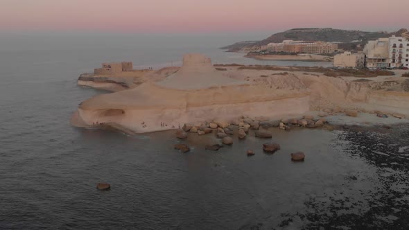 Aerial Flight Along Rocky Ocean