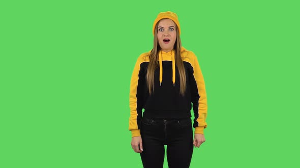 Modern Girl in Yellow Hat with Shocked Surprised Wow Face Expression. Green Screen