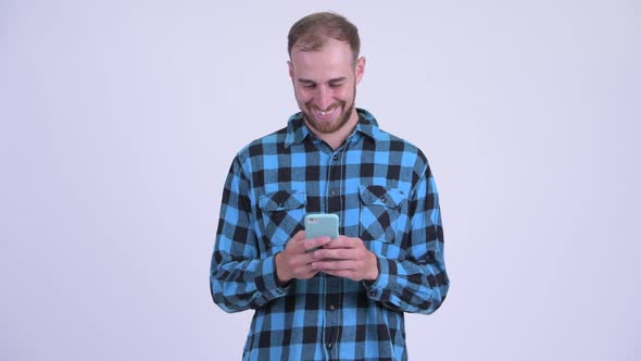 Happy Bearded Hipster Man Using Phone