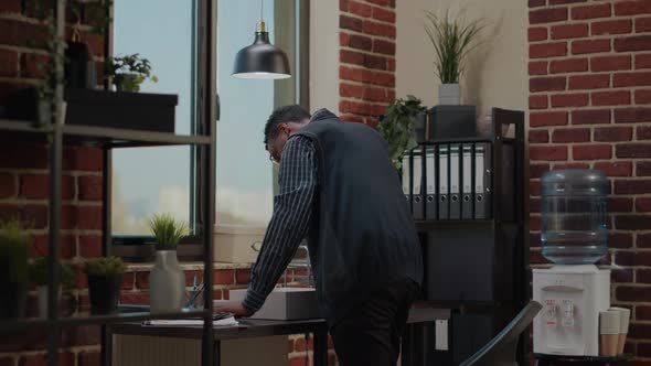 Stressed Man Getting Fired From Company Job and Packing Up Office Things