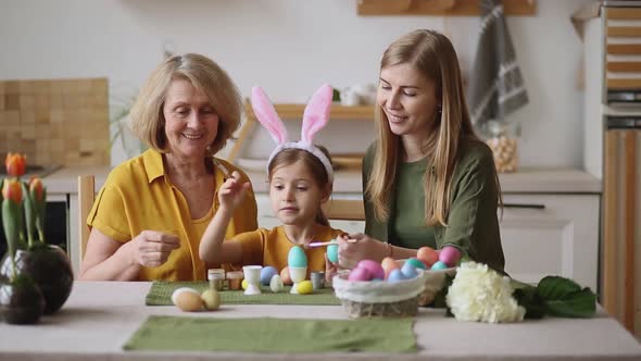 Happy Easter Family Elderly Grandmother and Young Woman Mother Blonde with Little Daughter with