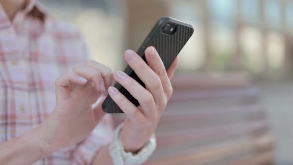 Close Up of Woman Using Smartphone Outdoor