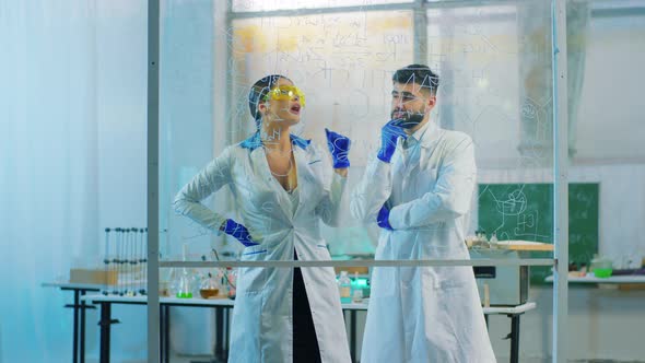 Attractive Woman Pharmacist and Her Colleague Man alt