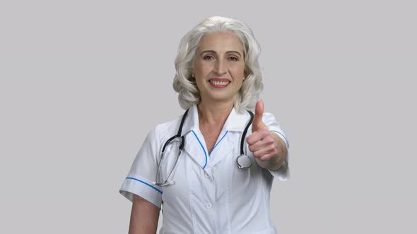 Old Senior Female Doctor Shows Thumb Up