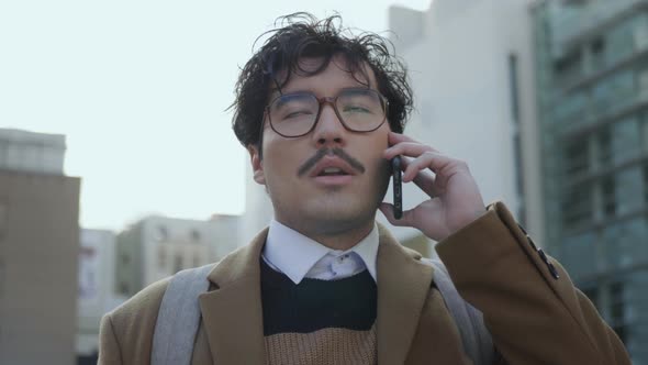 Business Man Having Phone Conversation Outdoors. Employee Using Phone on Street