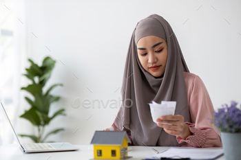 Muslim businesswoman dealing with real estate, buying and selling houses and insurance for real
