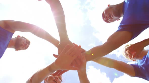 Fit people forming hands stack in boot camp 4k