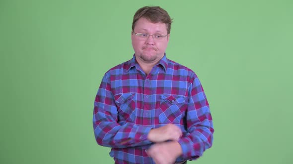 Stressed Overweight Bearded Hipster Man Looking Bored and Tired