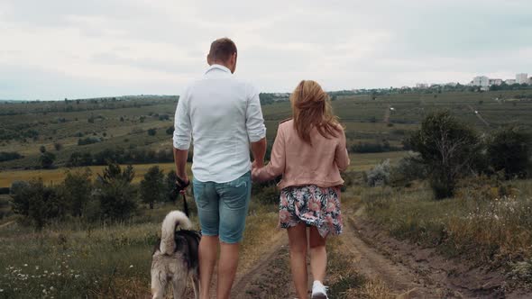 Two Young People Love Walk Field Their Dog