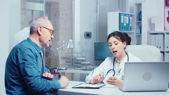 Elderly Retired Man Consulting with Doctor