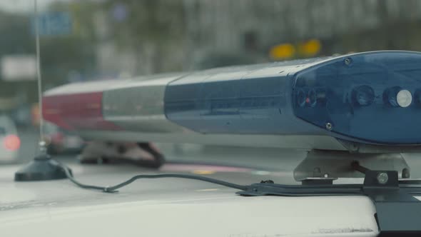 Flashing Flasher on the Roof of a Police Car