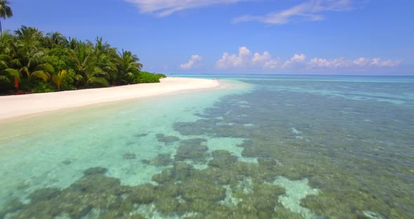 Aerial drone view of a scenic tropical island in the Maldives.