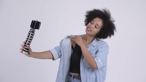 Young Happy African Woman Vlogging with Phone