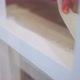 Crop unrecognizable woman sticking duct tape on steps at home - VideoHive Item for Sale