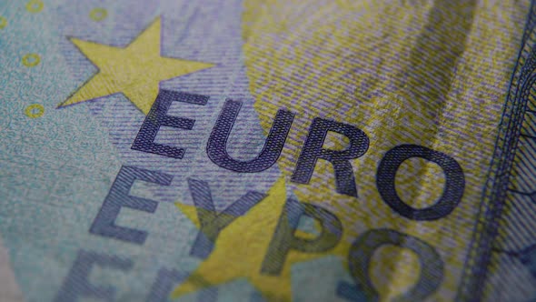 Macro shot Twenty euros. Super macro of embossing EURO on a blue banknote. 