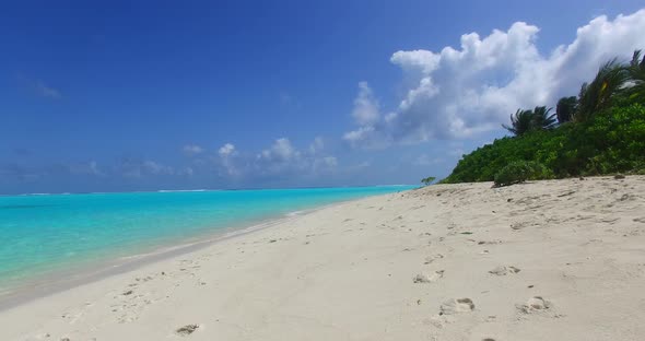 Natural fly over island view of a paradise sunny white sand beach and aqua turquoise water backgroun