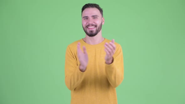 Happy Young Handsome Bearded Man Clapping Hands