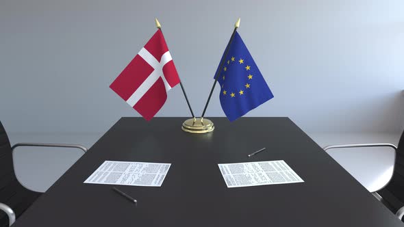 Flags of Denmark and the European Union on the Table