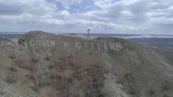 Orthodox cross on Mount Karabash. The camera flies to the mountain 02