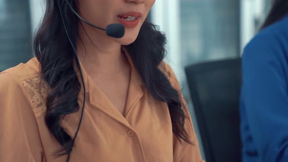 Businesswoman Wearing Headset Working Actively in Office