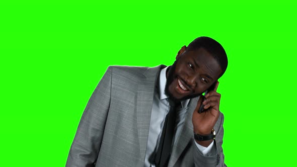 Smiling Black Businessman with Phone.