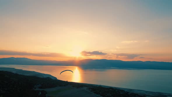 Sunset Landscape and a Person Flying