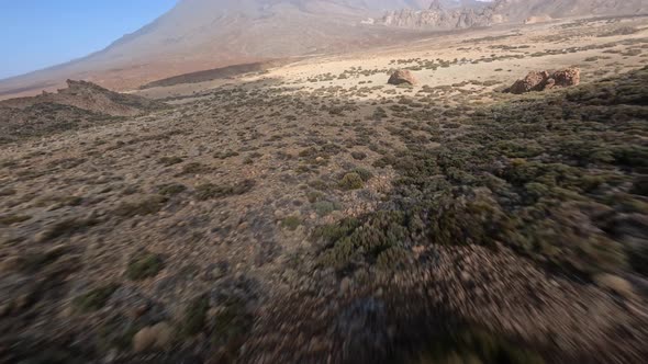 Cliff Rock and Mountain Surfing with a FPV Drone in a Desert and Moon Like Sandy and Rocky Landscape