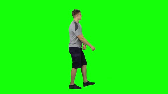Guy Goes and Dances, Smiles and Rejoices on a Green screen.Profile Side View