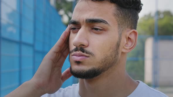 Closeup Portrait Sad Tired Young Middle Eastern Arab Man Rubbing Temple