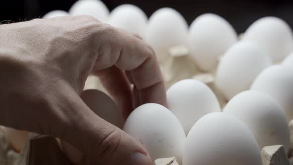 Farmer Taking Eggs from a Pile