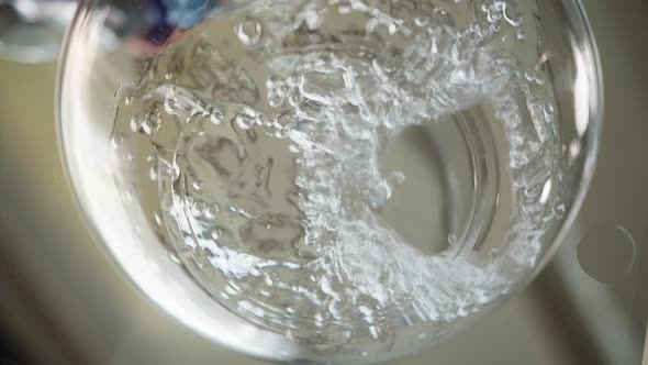 Closeup of Pouring Fresh Water for Hungry Golden Retriever Dog Into Bowl