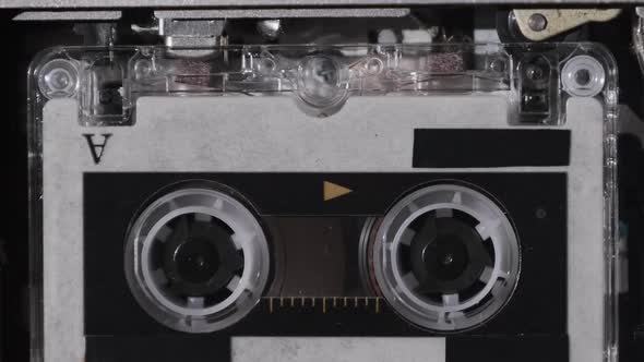 The Microcassette Spins in a Portable Handheld Recorder Tape Retro Player