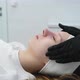 Cosmetologist Applies a Woman a Therapeutic Mask on Her Face - VideoHive Item for Sale