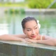 Young asian woman enjoy around outdoor swimming pool for leisure - VideoHive Item for Sale