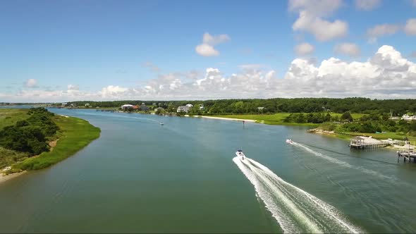 Drone tracking boat in the IntraCoastal waterway near Ocean Isle Beach and Shallotte NC